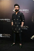 Black embroidered men's kurta with matching pajama, designer party wear attire by Pravo Hammens for weddings and special occasions.