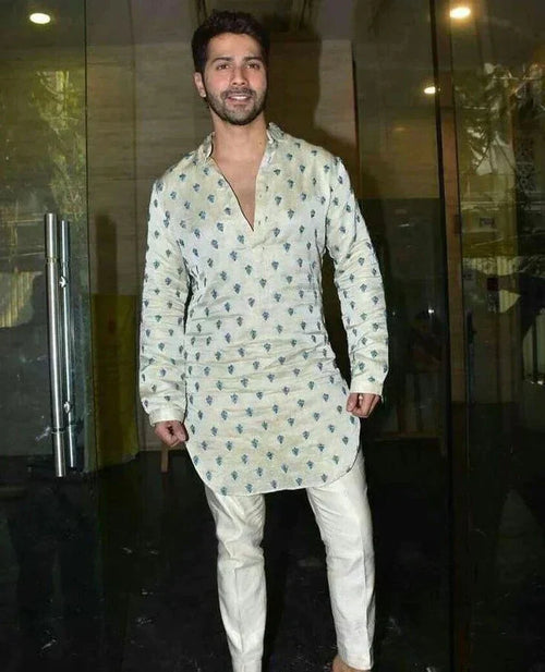 Embroidered men's kurta with traditional motifs and matching pajama, crafted by pravohammenskurta, displayed on a plain background.