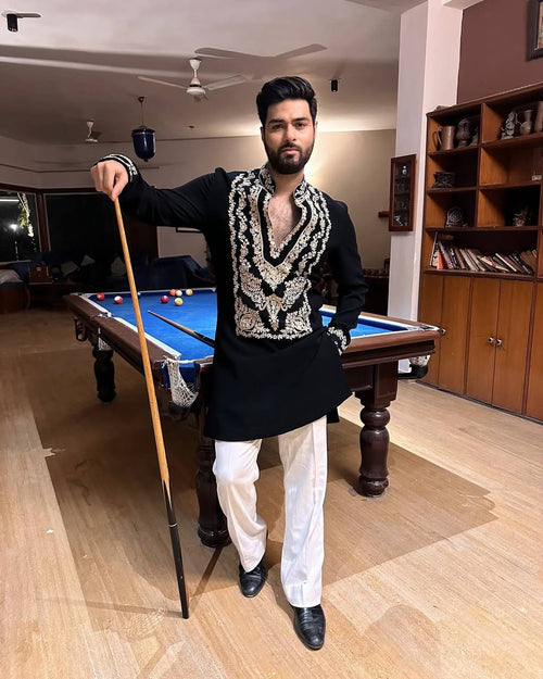 Black men's kurta pajama with stylish neck pattern and embroidered work, featuring intricate designs on the kurta from pravohammenskurta.